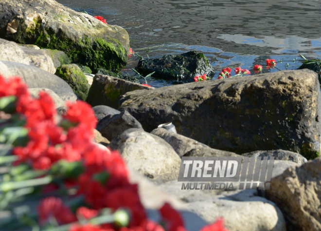 Baku residents bringing flowers to Seaside Boulevard to honor missing oil workers.  Azerbaijan, Dec.07, 2015